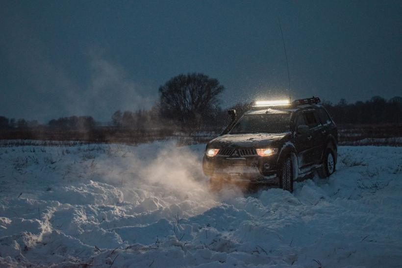 Vehicle stuck in deep snow at night